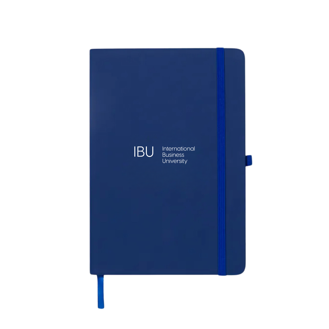A closed, royal blue International Business University notebook with the IBU logo on the cover